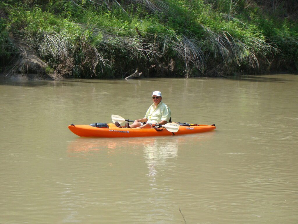 Paddler on orange kayak