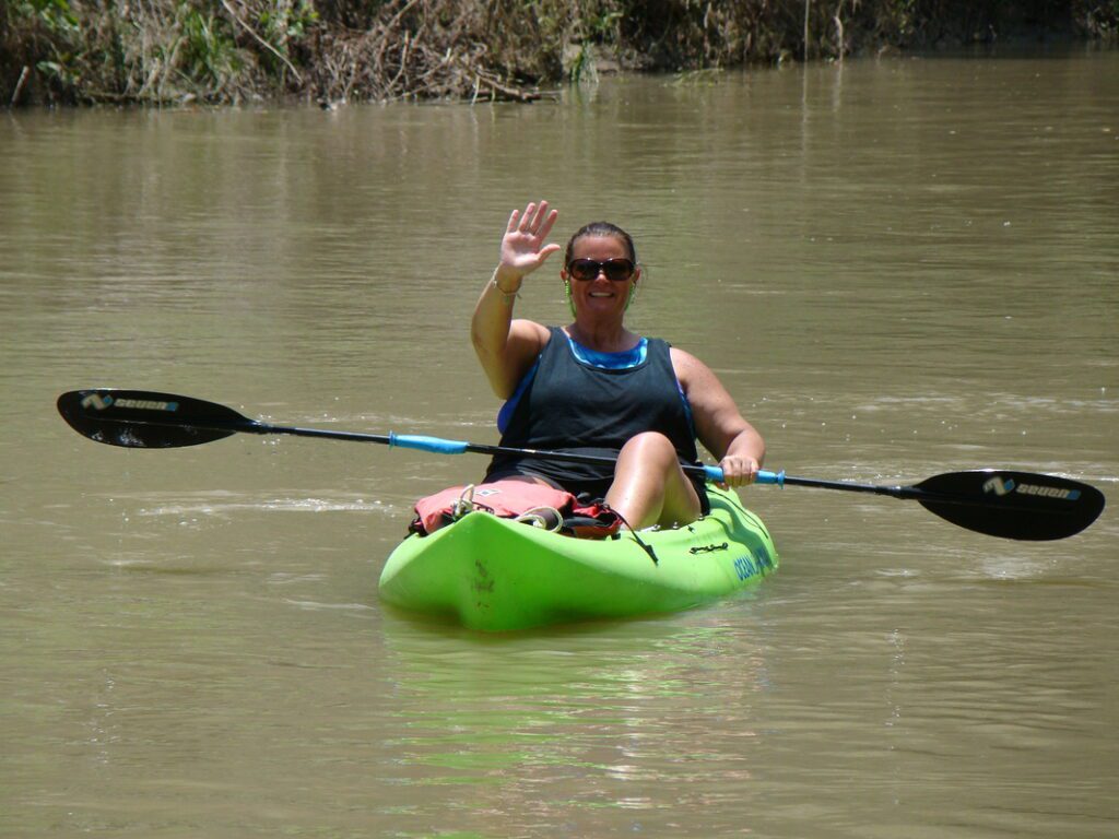 Paddler on green kayak