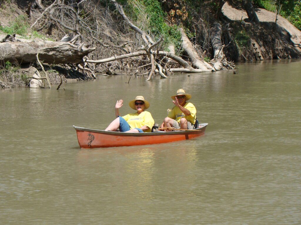 Paddlers in canoe on river