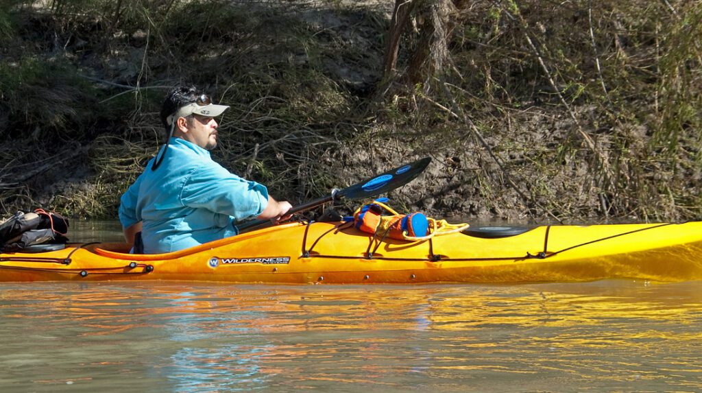 Paddler on yellow kayak